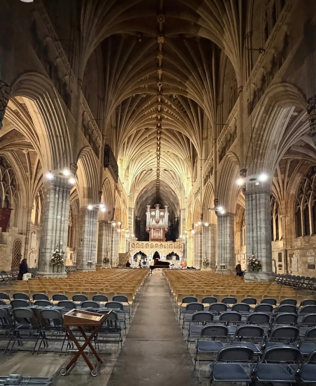 Grand Gothic cathedral interior with soaring vaulted arches and pipe organ
